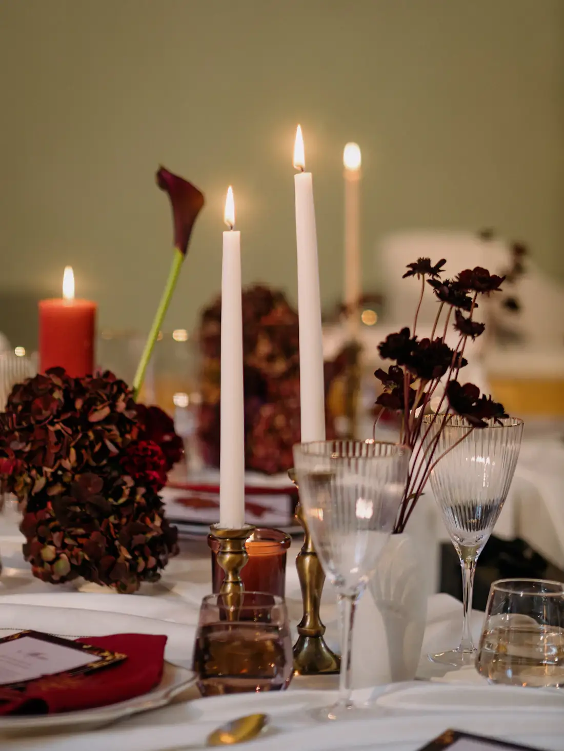 Candle-lit anniversary table with flowers