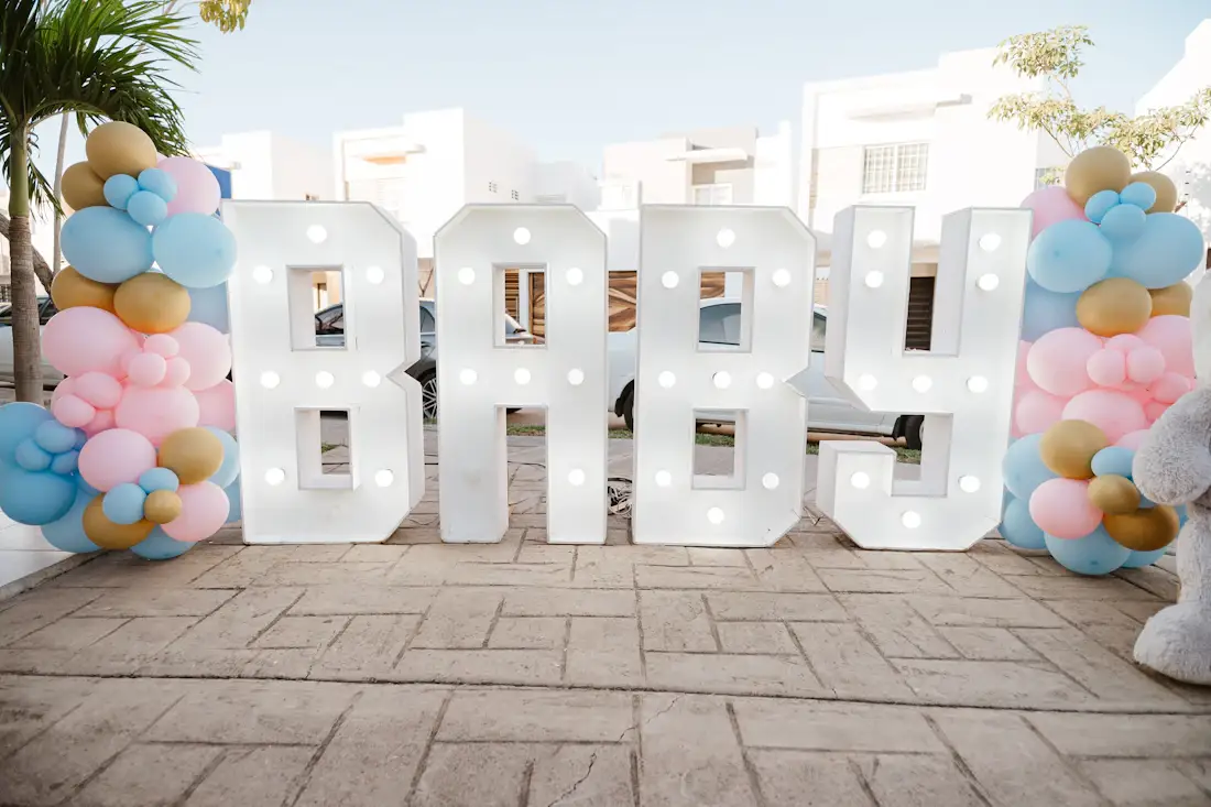 Baby shower setup with balloons and light-up letters