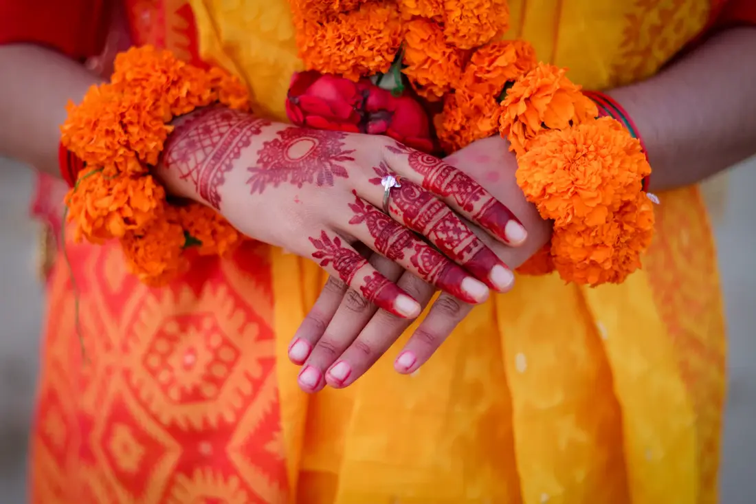 Henna hands with marigold garlands by Events by OT