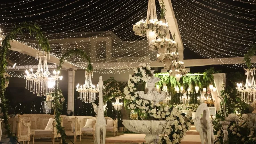 Floral fountain under fairy lights by Events by OT