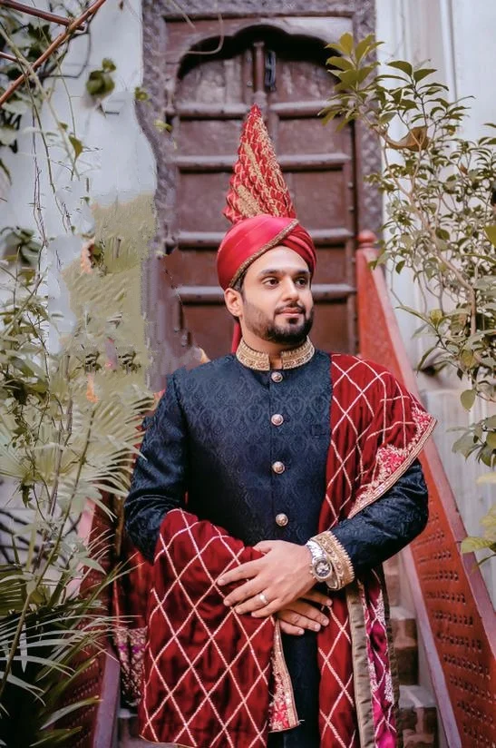 Groom in sherwani and kulla on his barat day