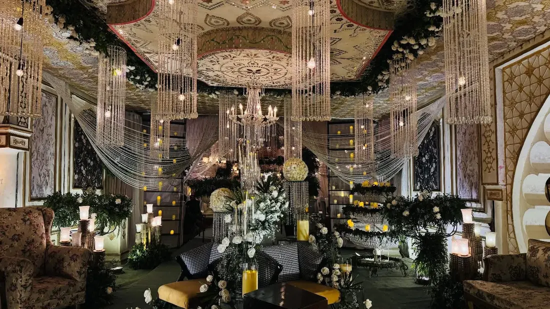 Crystal-draped lounge with white florals by Events by OT