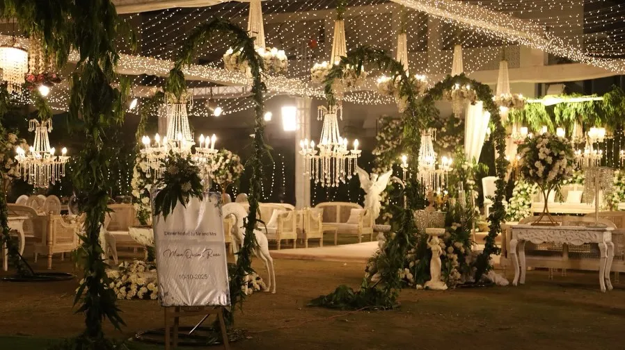 Candle-lit white floral night aisle by Events by OT