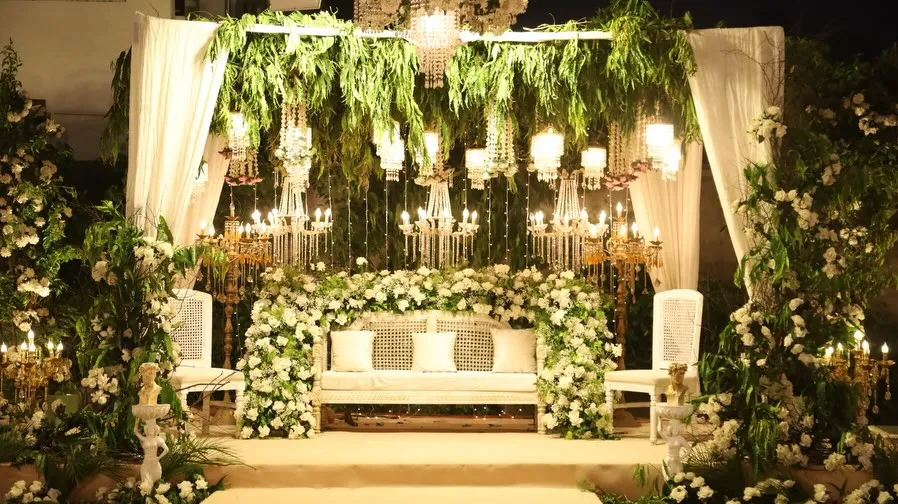 White floral stage at night by Events by OT
