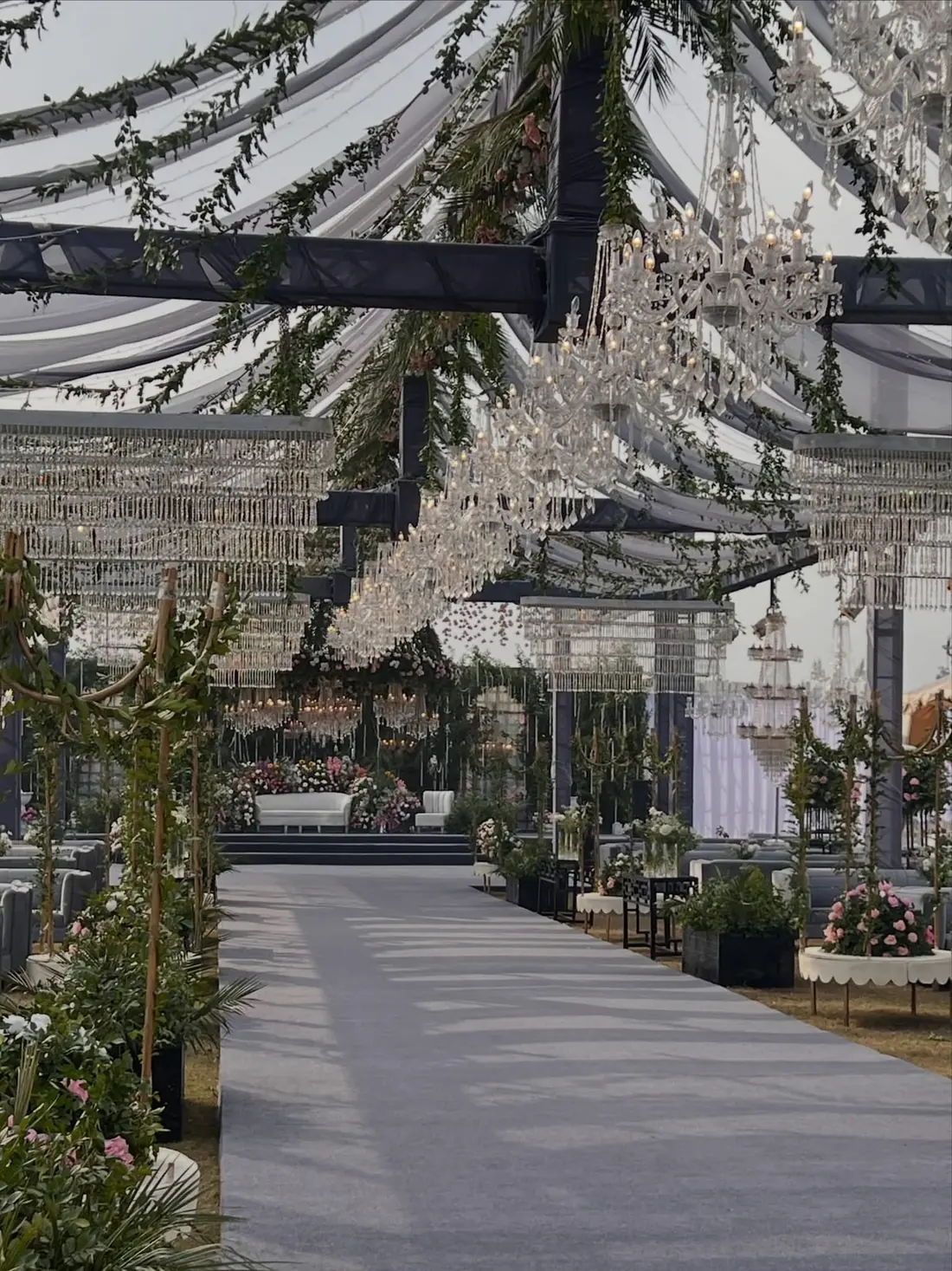 Garden nikkah setup with chandeliers and floral aisle by Events by OT