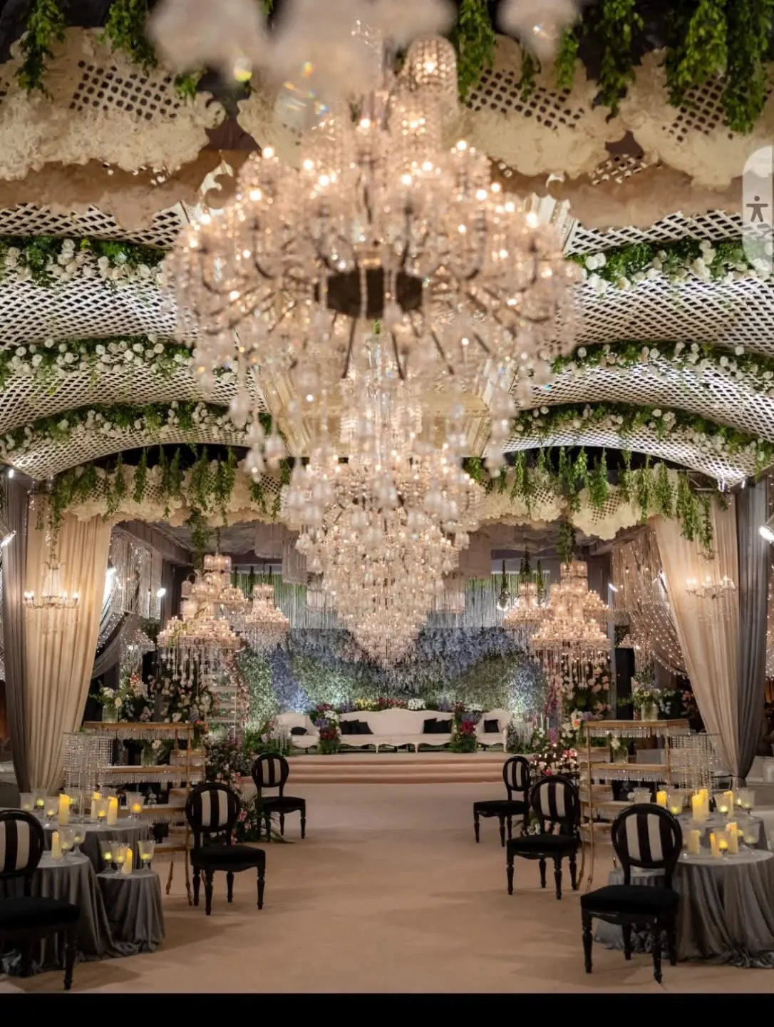 White floral ceiling with crystal chandelier by Events by OT