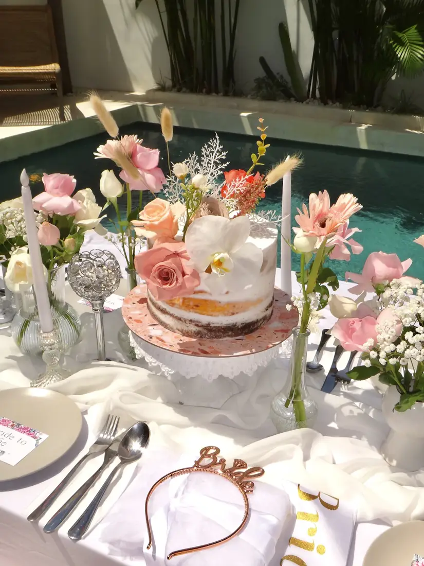Bridal shower cake table with flowers